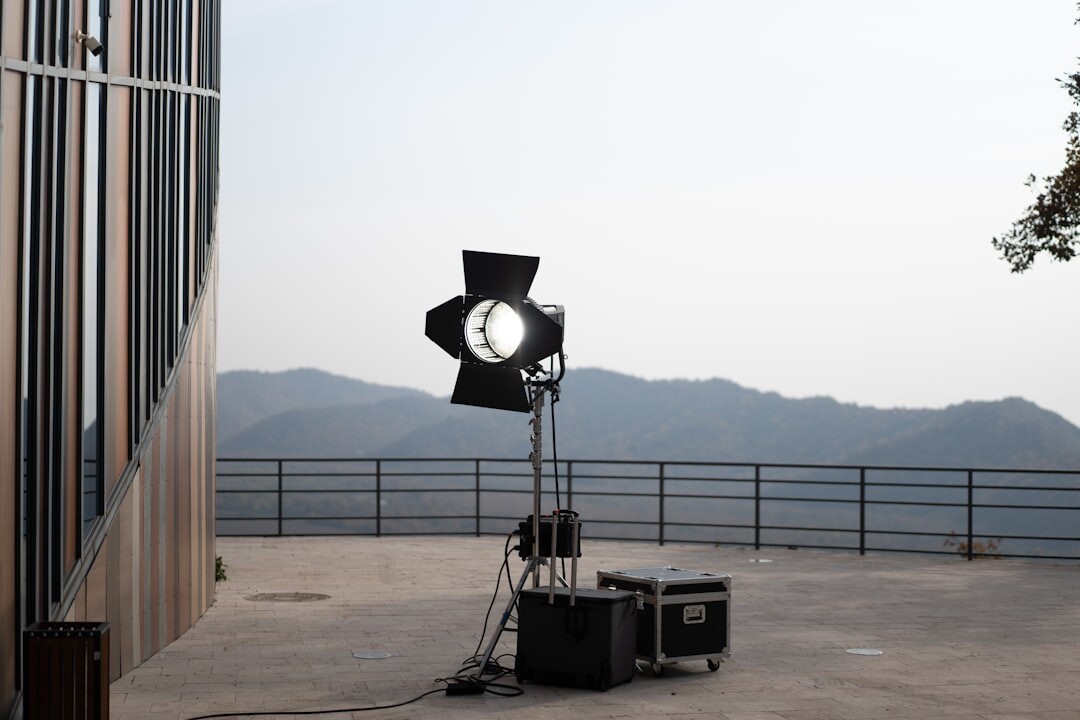 Vintage television commercial film set with studio lights and a large film camera