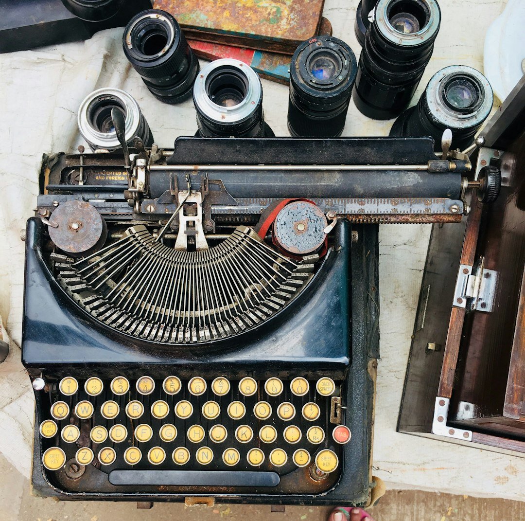 Copywriter typing an advertising slogan on a vintage typewriter